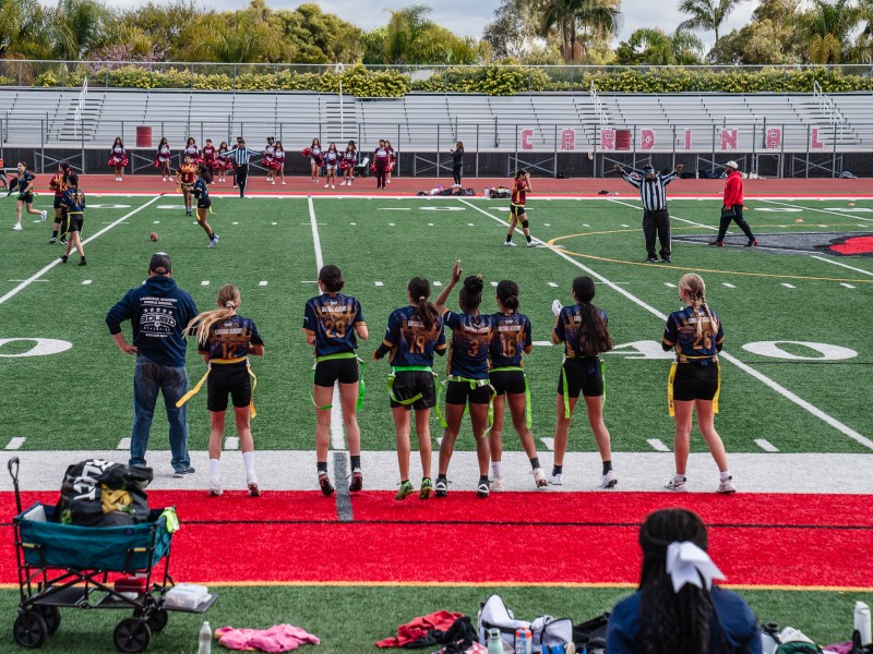 Students play flag football at Herbert Hoover High School in City Heights on April 26, 2025. / Ariana Drehsler for Voice of San Diego