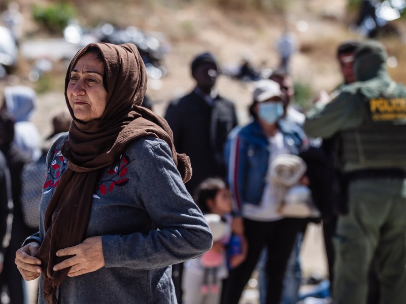 Asylum seekers wait at the US-Mexico border in San Ysidro on May 9, 2023.