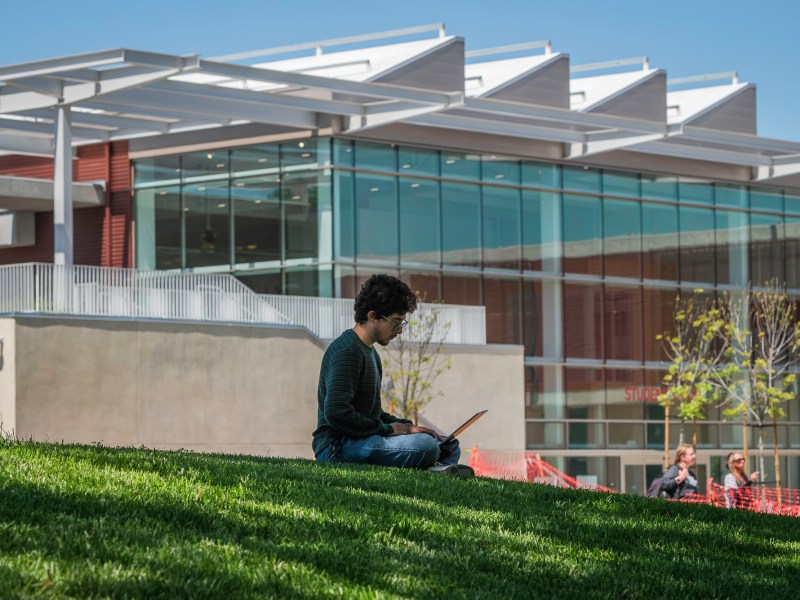 A student types on a laptop at Southwestern College in Chula Vista on April 9, 2025. / Photo by Vito di Stefano for Voice of San Diego