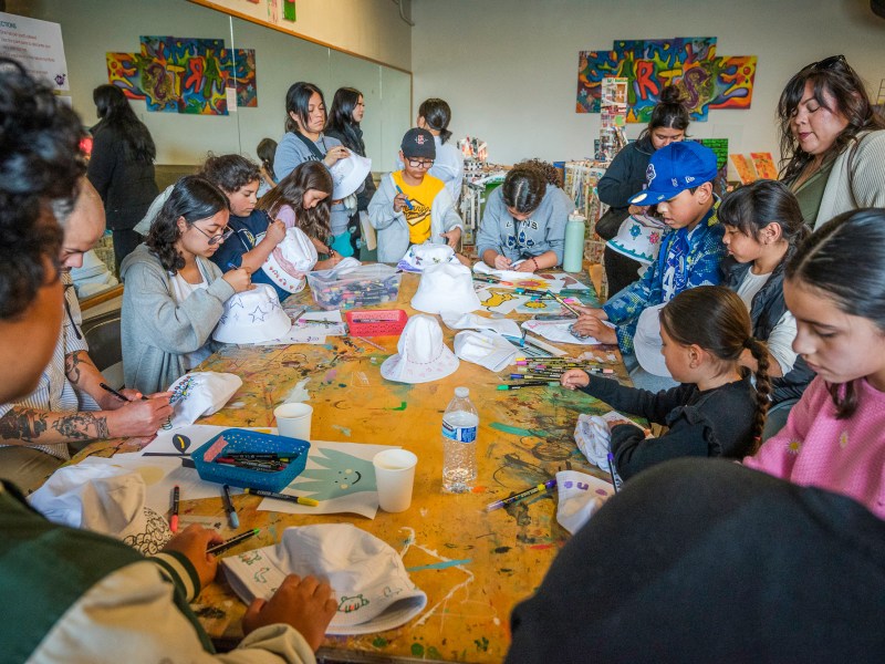 Community members and young artists attend A Reason to Survive's In Bloom: Youth Arts Festival on Saturday, May 3, 2025, in National City. / Photo by Vito di Stefano for Voice of San Diego